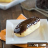 Decadent Chocolate Eclairs 3 A chocolate eclair on a plate