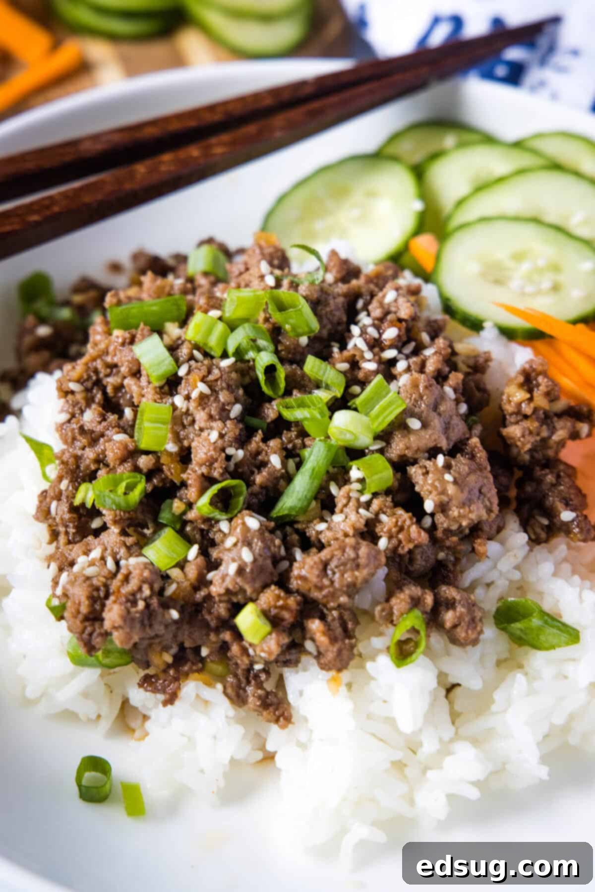 korean beef over rice with cucucumbers and carrots