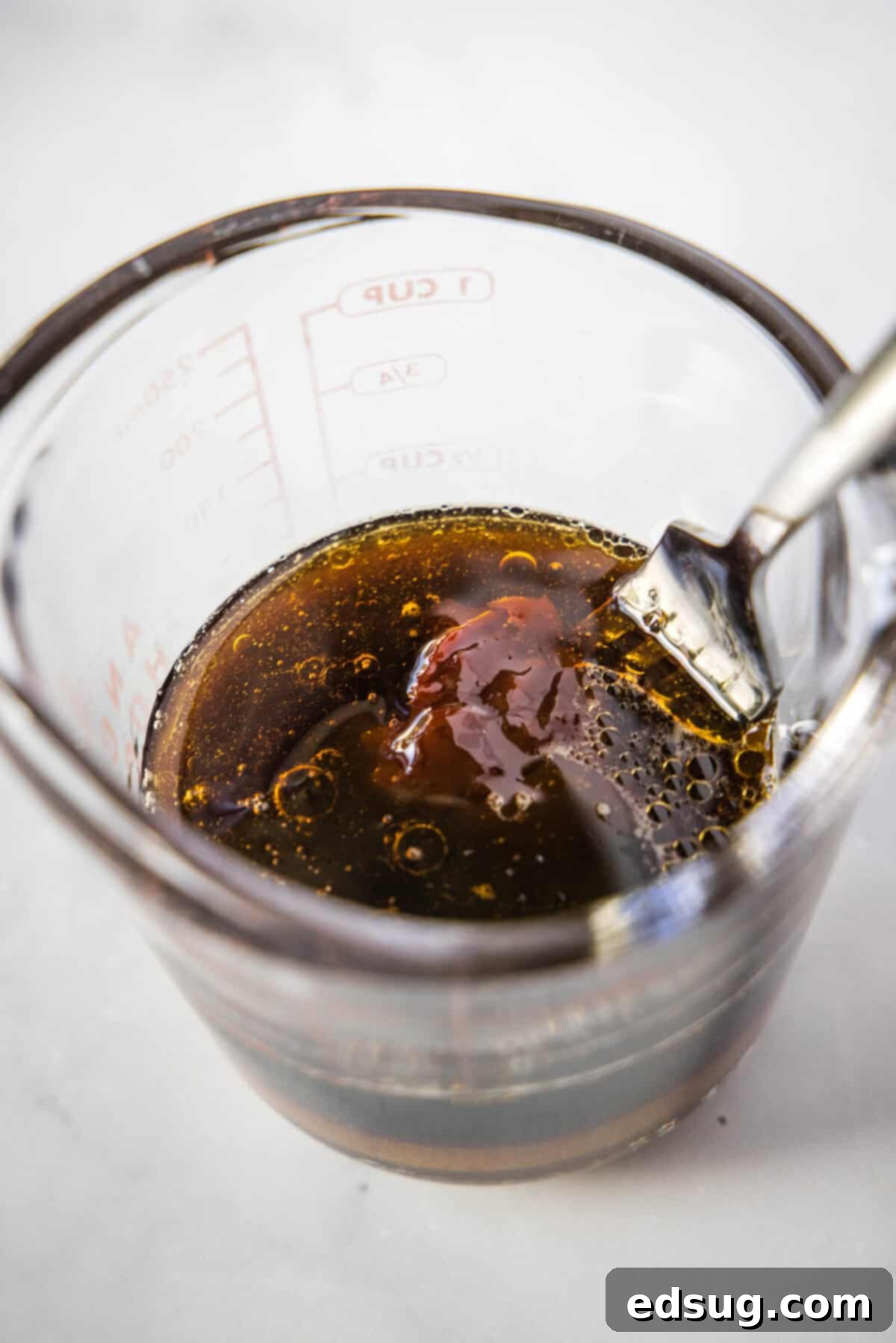 korean beef bowls sauce in a measuring cup
